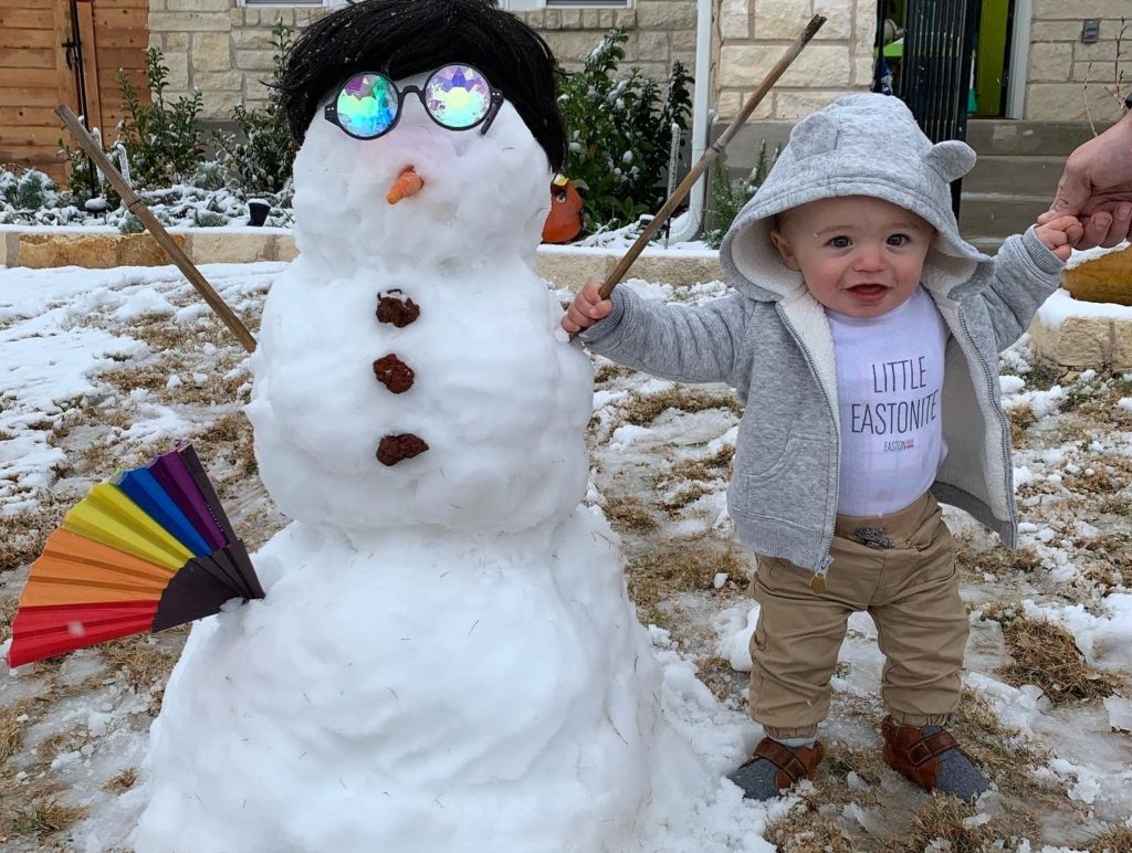 Baby with snowman
