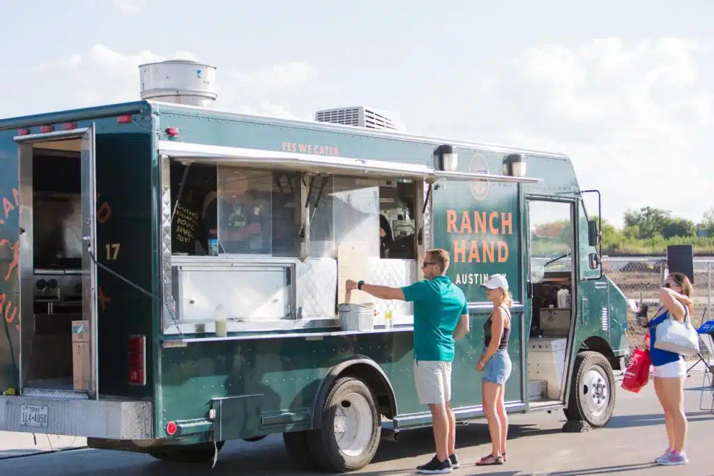 Ranch Hand copy Customers ordering from the Ranch Hand Austin food truck in Southeast Austin