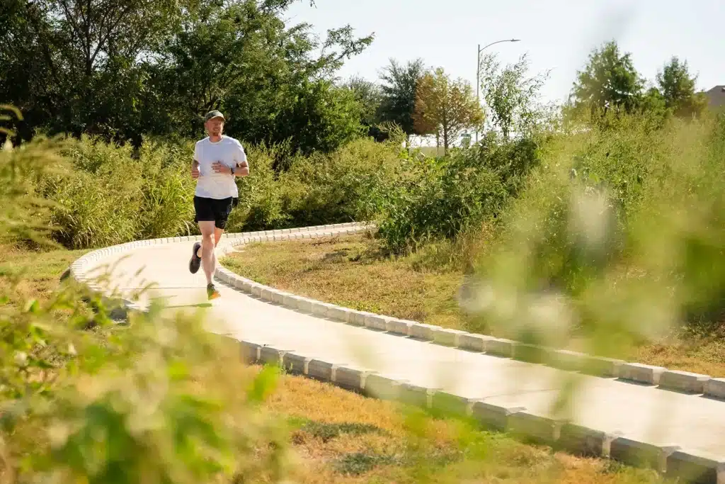 Person jogging on trail in Easton Park, Austin, Texas.